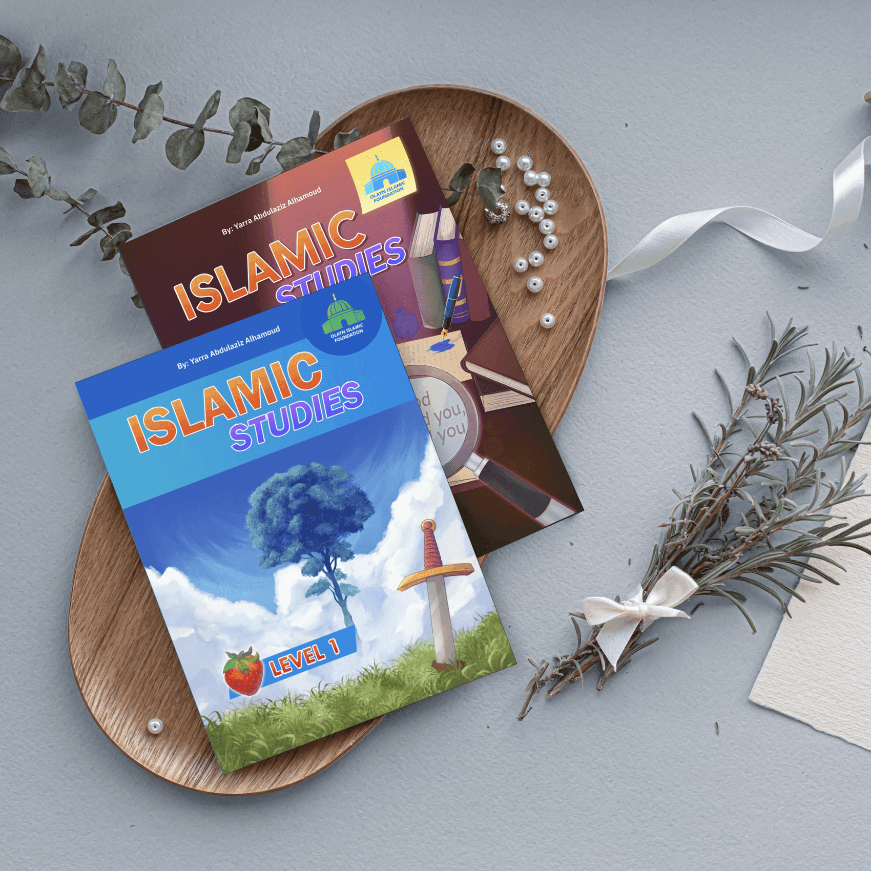 The printed Islamic Studies Level 1 series — Textbook, Activity Book, and Teacher's Manual, authored and designed by Yarra Abdulaziz Alhamoud, styled on wooden plates